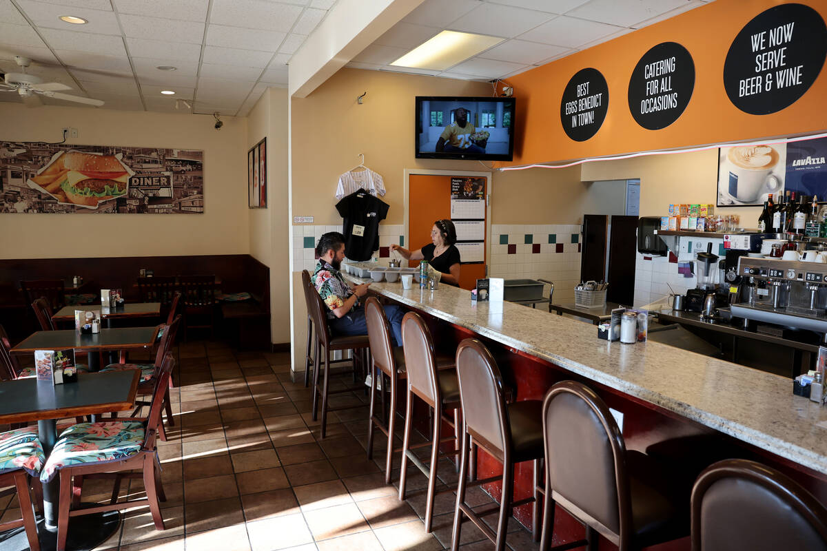 Egla Navarro visits with regular customer Alizander Mellado at NORMan’s Diner on South D ...