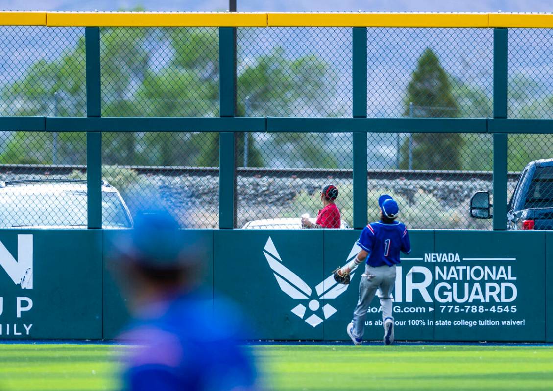Reno outfielder Jackson Berg (1) watches as a Basic home run clears the fence during the final ...