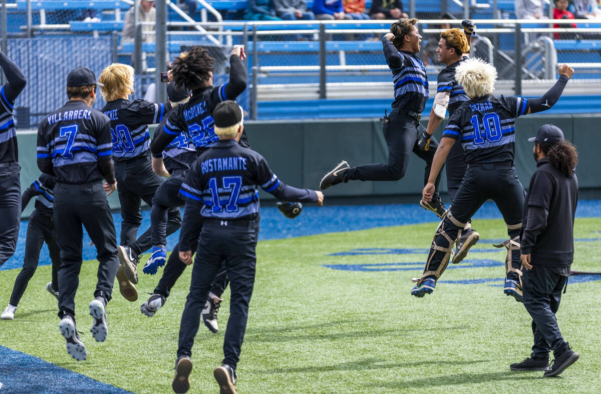 Basic players celebrate their first score of the game against Reno during the final of the 5A b ...