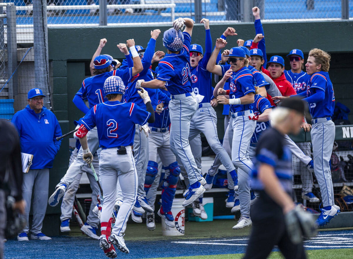 Reno players celebrate their first score of the game against Basic during the final of the 5A b ...