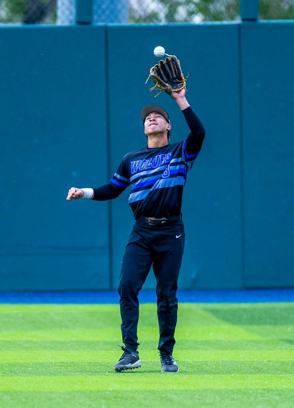 Basic outfielder Tate Southisene (8) looks in a fly ball against Reno during the final of the 5 ...