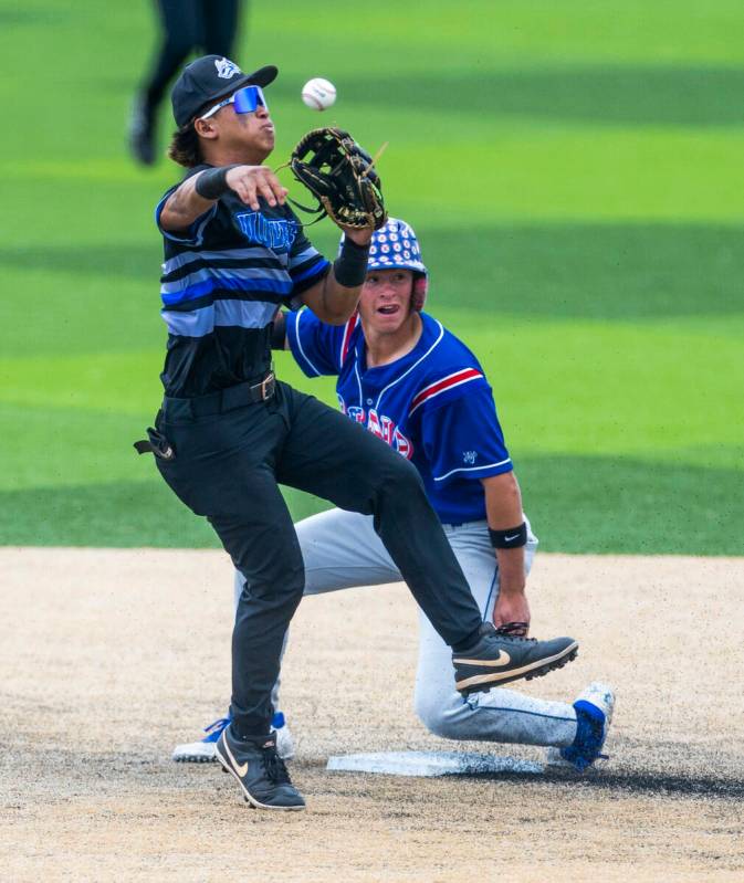 Basic infielder Troy Southisene (2) makes the tag out at second base on Reno runner Logan Ford ...