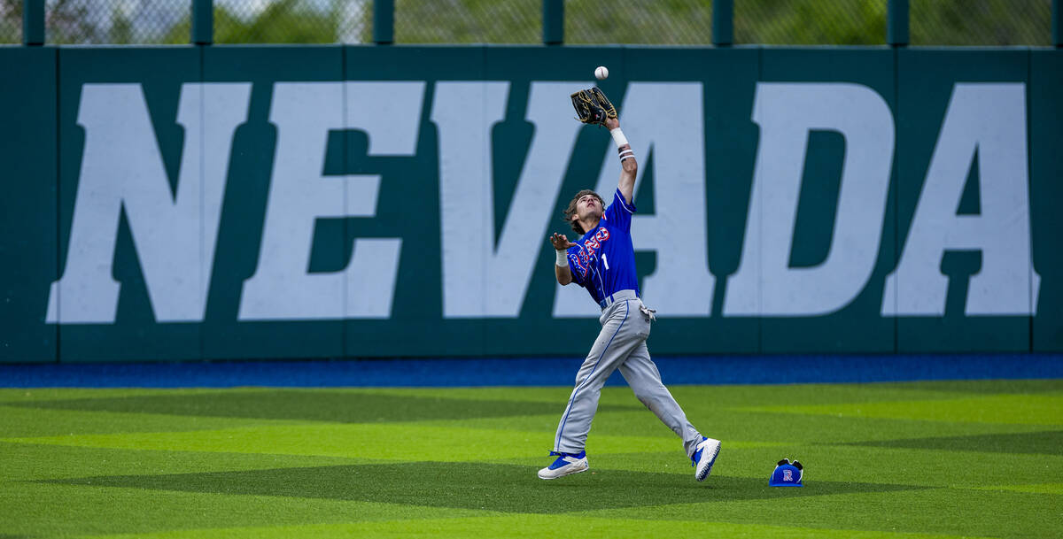Reno outfielder Jackson Berg (1) runs back and extends to make a great catch against Basic duri ...