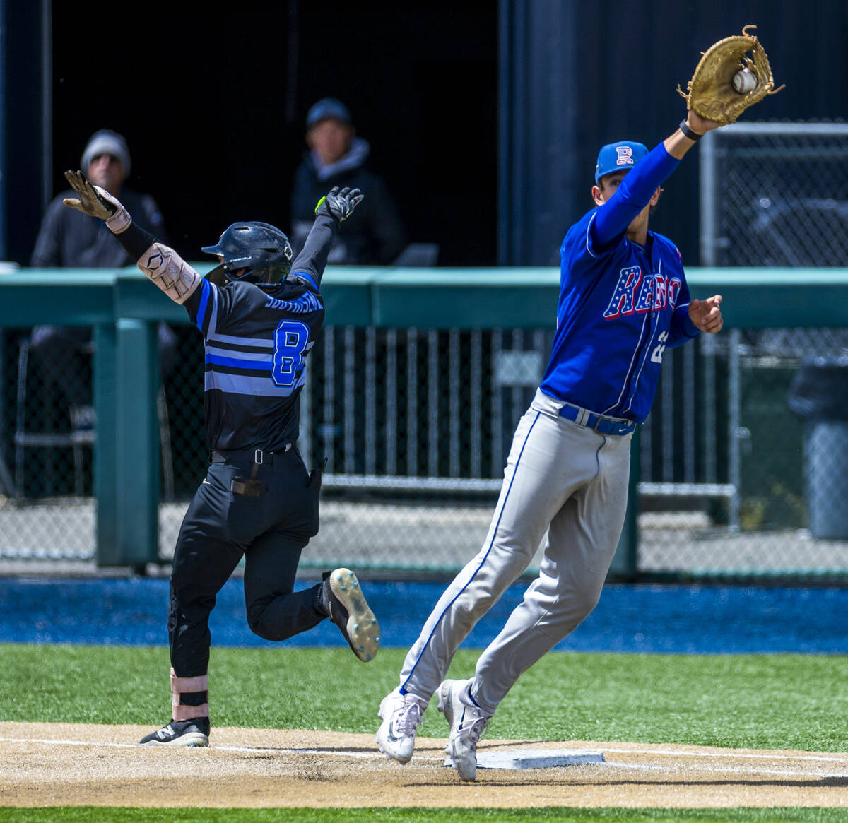 Basic runner Tate Southisene (8) beats the throw to first base as Reno infielder Maack Edwards ...