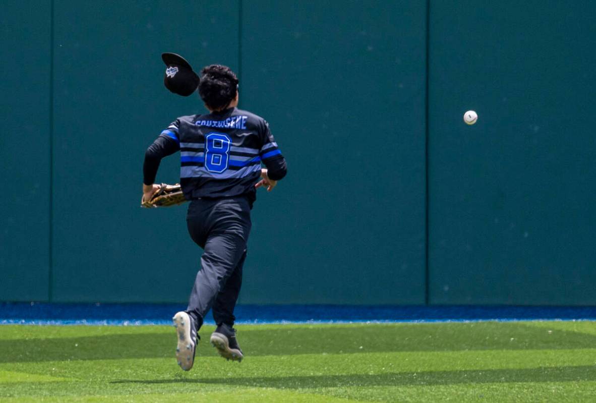 Basic outfielder Tate Southisene (8) chases down a long fly ball from a Reno batter during the ...