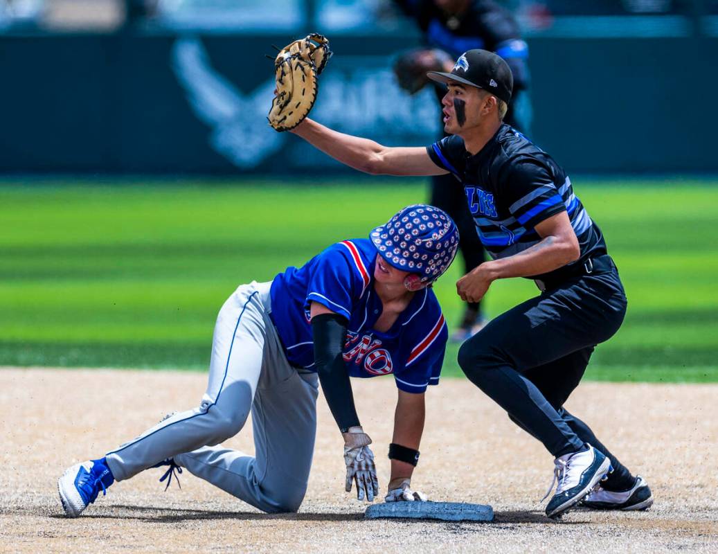 Basic infielder Adrian Ramos (1) shows the official he has the ball for an out at second base a ...