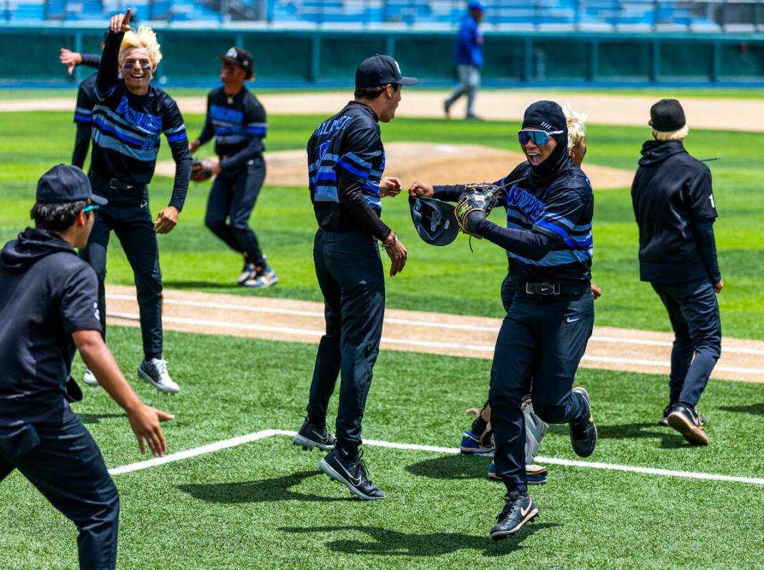 Basic players are pumped up as they keep Reno from scoring in extra innings during the final of ...