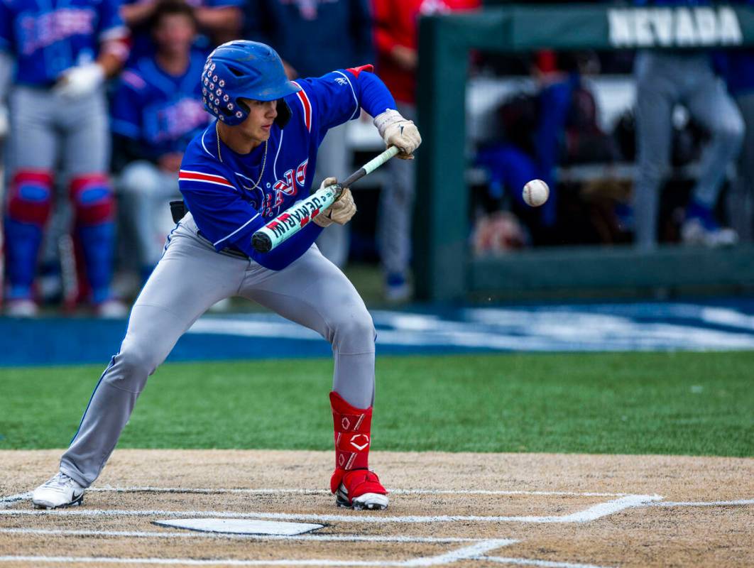 Reno batter Braden Jones (2) bunts a Basic pitch in extra innings during the final of the 5A ba ...