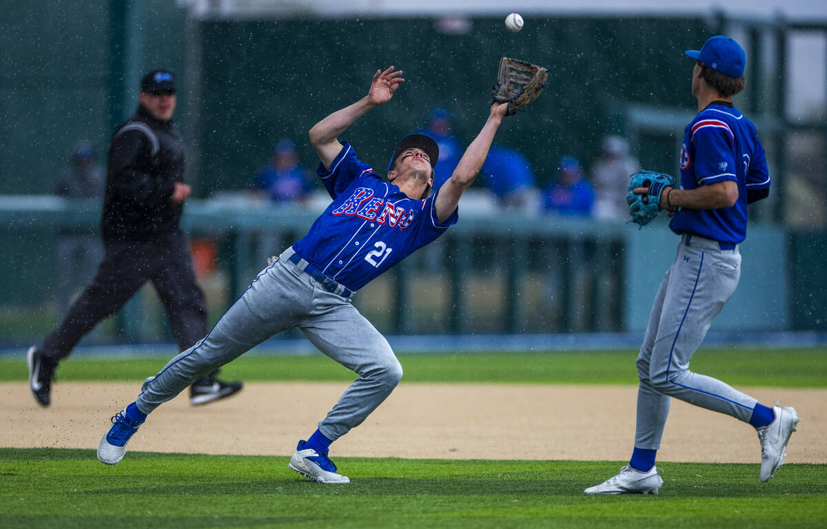 Basic Reno infielder Mac Vandergrift (21) makes a great pop fly catch in the rain in extra inni ...