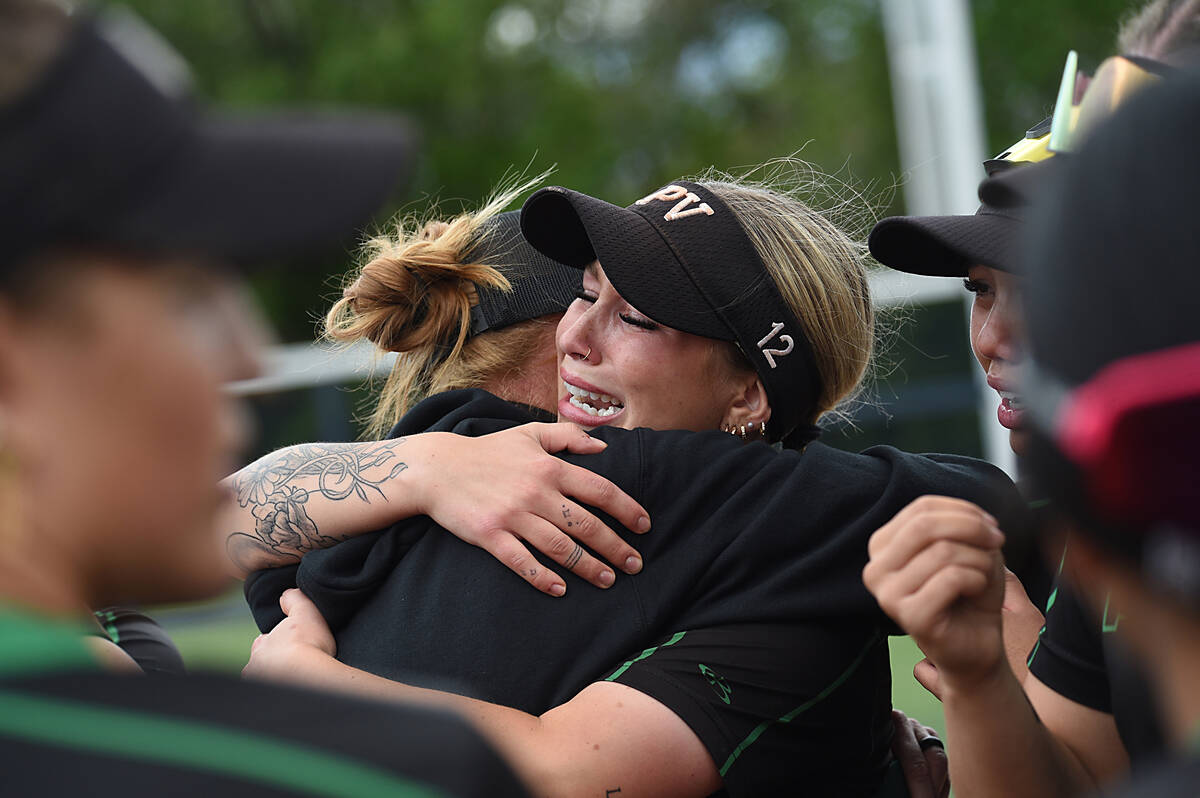 Palo Verde’s Paige Brandes hugs head coach Kelly Glass after defeating Centennial 7-3 to win ...