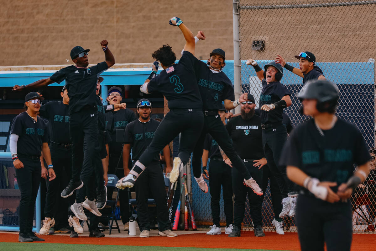 Silverado’s baseball team celebrates a homerun by teammate Giovanni Guariglia (3), cente ...