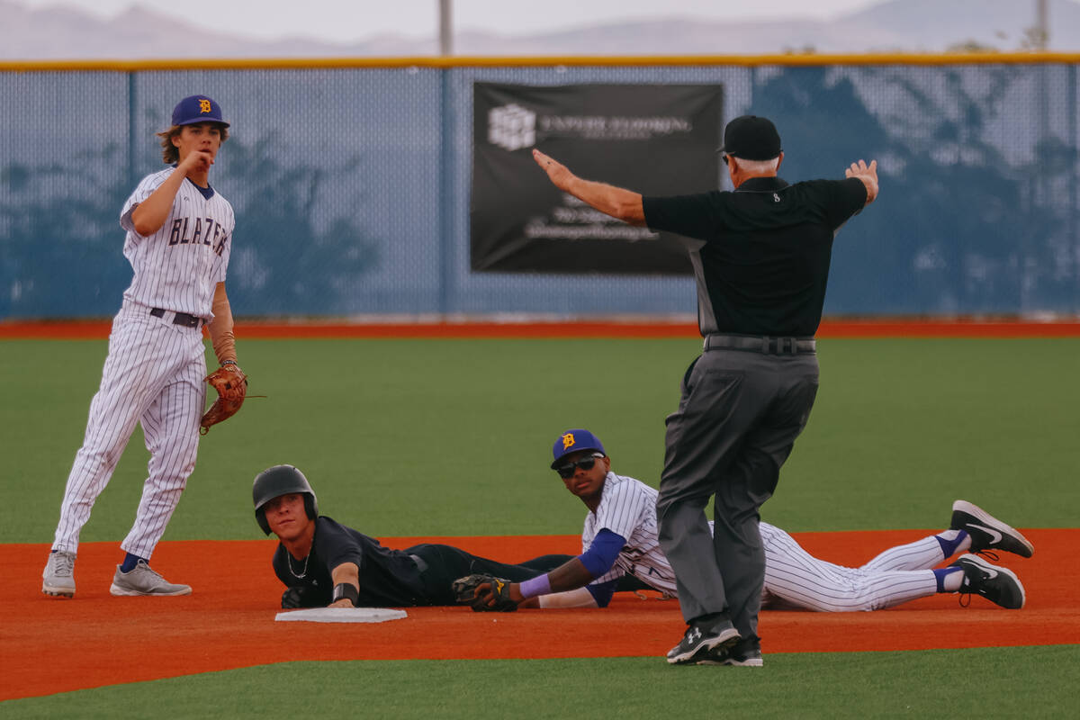 Durango infielders Aiden Farrell (4) and Alexander Mercurius (7), and Silverado runner Nathanie ...