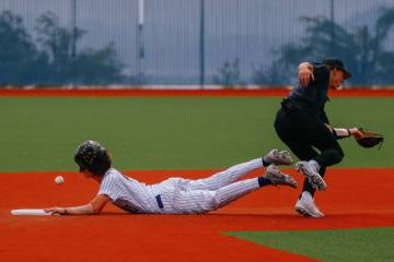 Durango runner Aiden Farrell (4) successfully steals second base after a flubbed pass to Silver ...