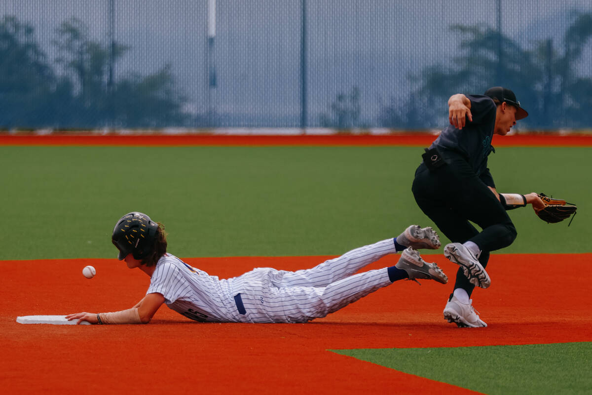 Durango runner Aiden Farrell (4) successfully steals second base after a flubbed pass to Silver ...