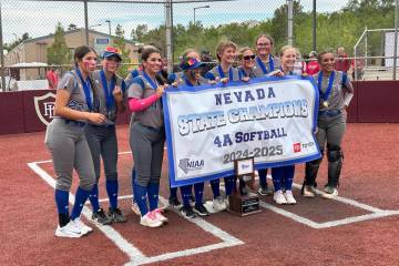 The Basic softball team celebrates its second consecutive Class 4A state championship on Saturd ...