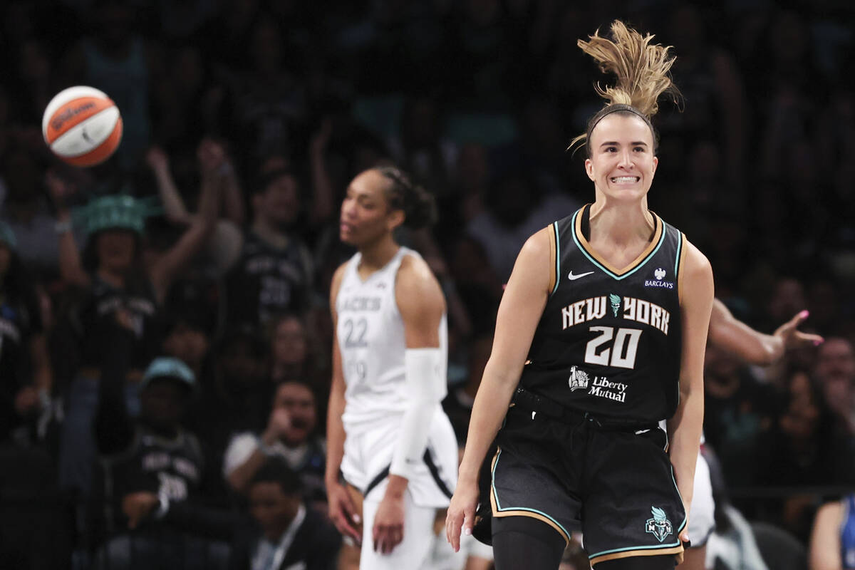 New York Liberty guard Sabrina Ionescu (20) reacts after drawing a foul and scoring during the ...