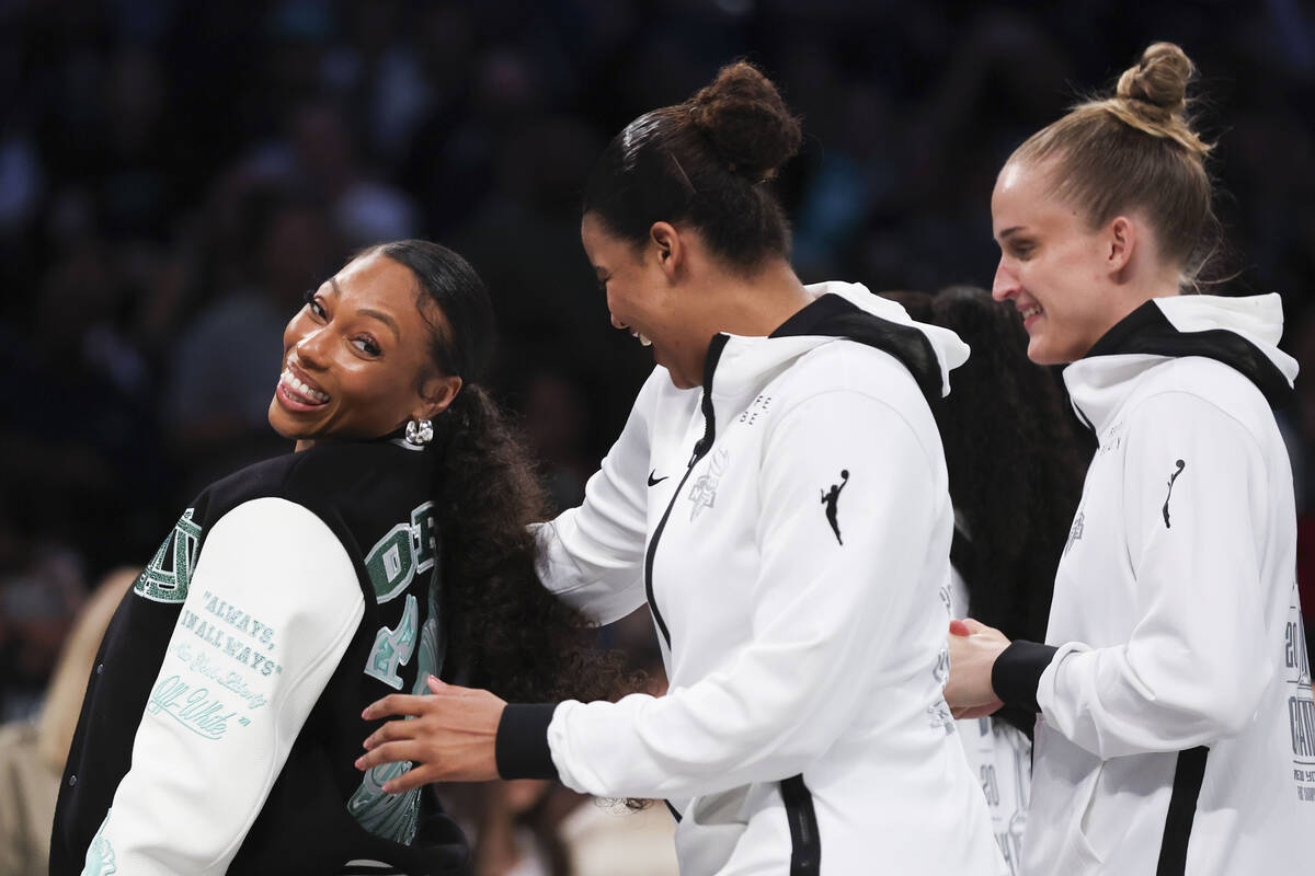 New York Liberty's Betnijah Laney-Hamilton, left, reacts with teammates before they receive the ...