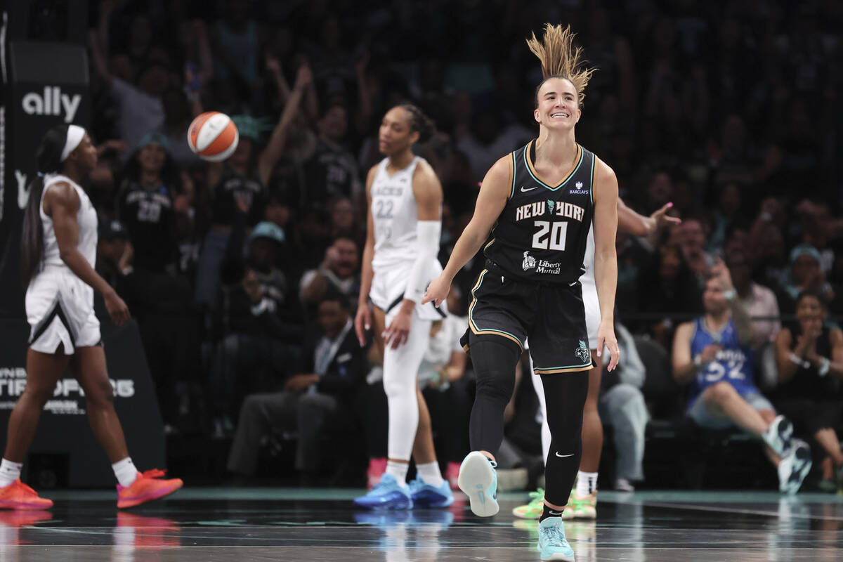 New York Liberty guard Sabrina Ionescu (20) reacts after drawing a foul and scoring during the ...