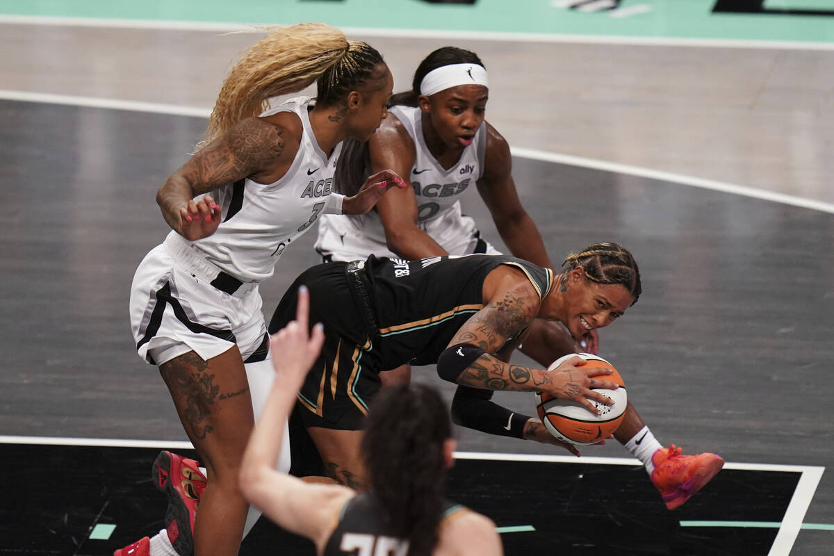 New York Liberty guard Natasha Cloud (9) falls on the court during a WNBA basketball game again ...