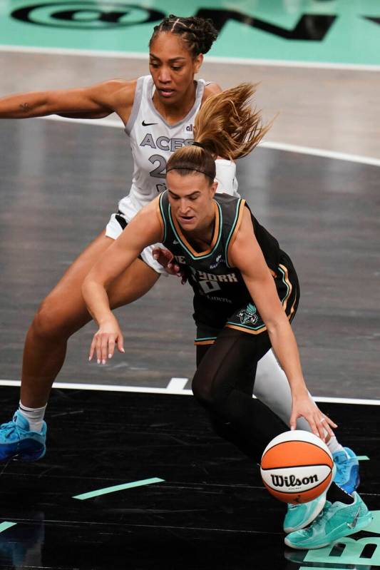 New York Liberty guard Sabrina Ionescu (20) drives the ball down court during a WNBA basketball ...