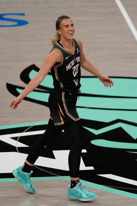 New York Liberty guard Sabrina Ionescu (20) looks to the crowd after scoring a basket during a ...