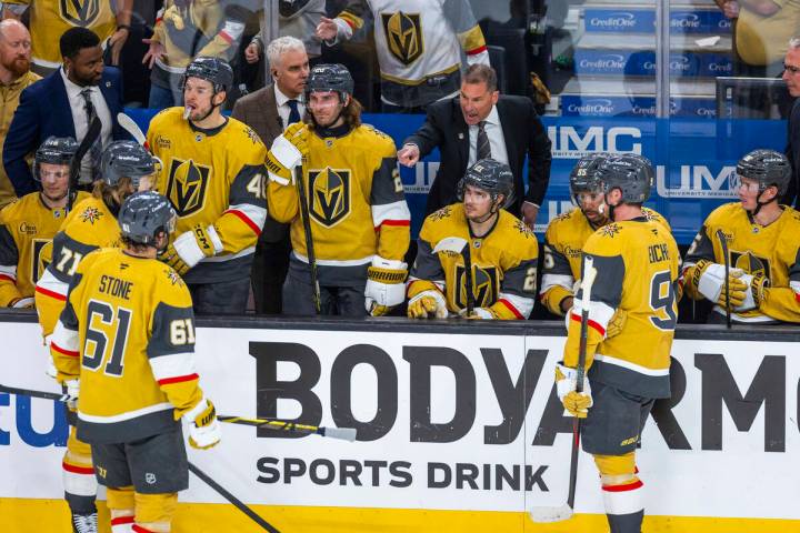 Golden Knights head coach Bruce Cassidy has instructions for his players during a timeout again ...