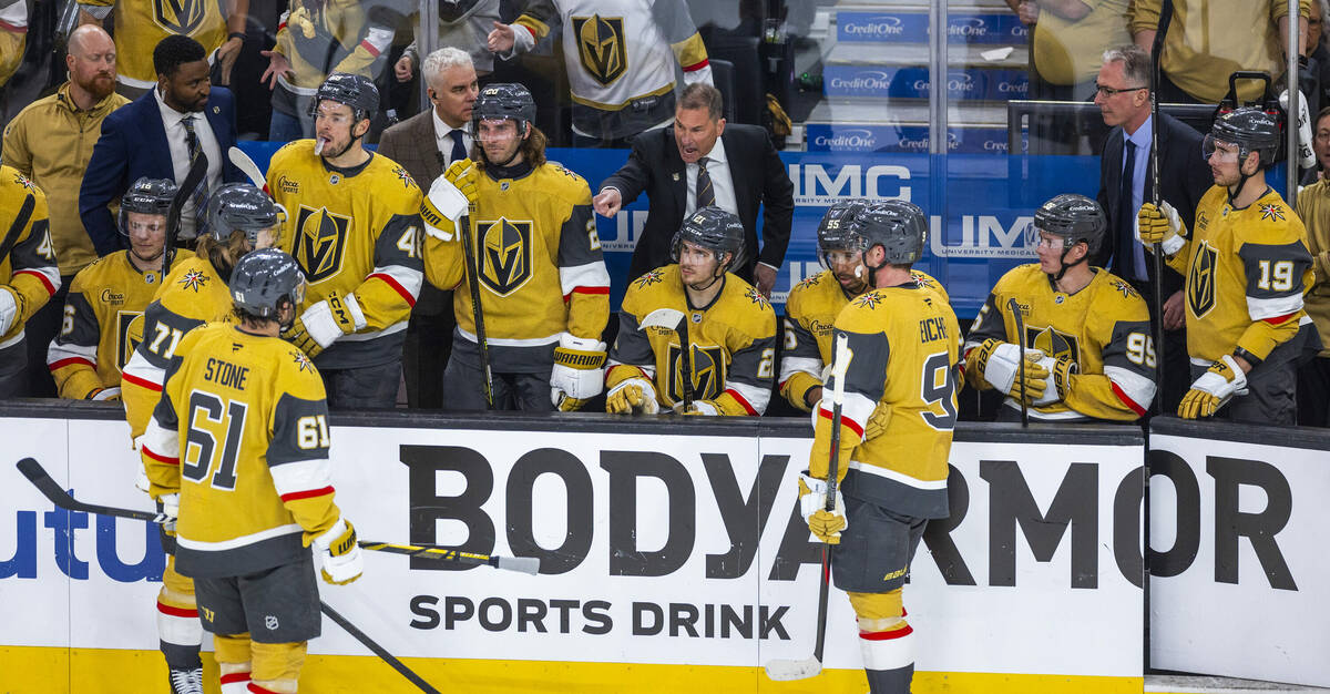 Golden Knights head coach Bruce Cassidy has instructions for his players during a timeout again ...