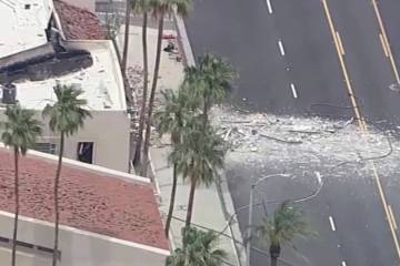 Debris covers the ground after an explosion on Saturday, May 17, 2025 in Palm Springs, Calif. ...