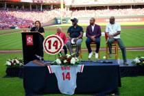 Pete Rose's daughter Fawn Rose speaks as Reds Hall of Fame players, left to right, George Foste ...