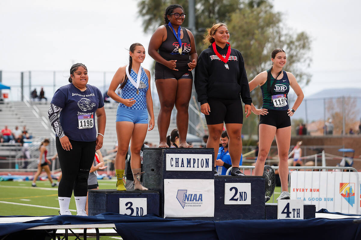 Medal winners of the NIAA 5A Girls discus throw final on the podium at Desert Oasis High School ...