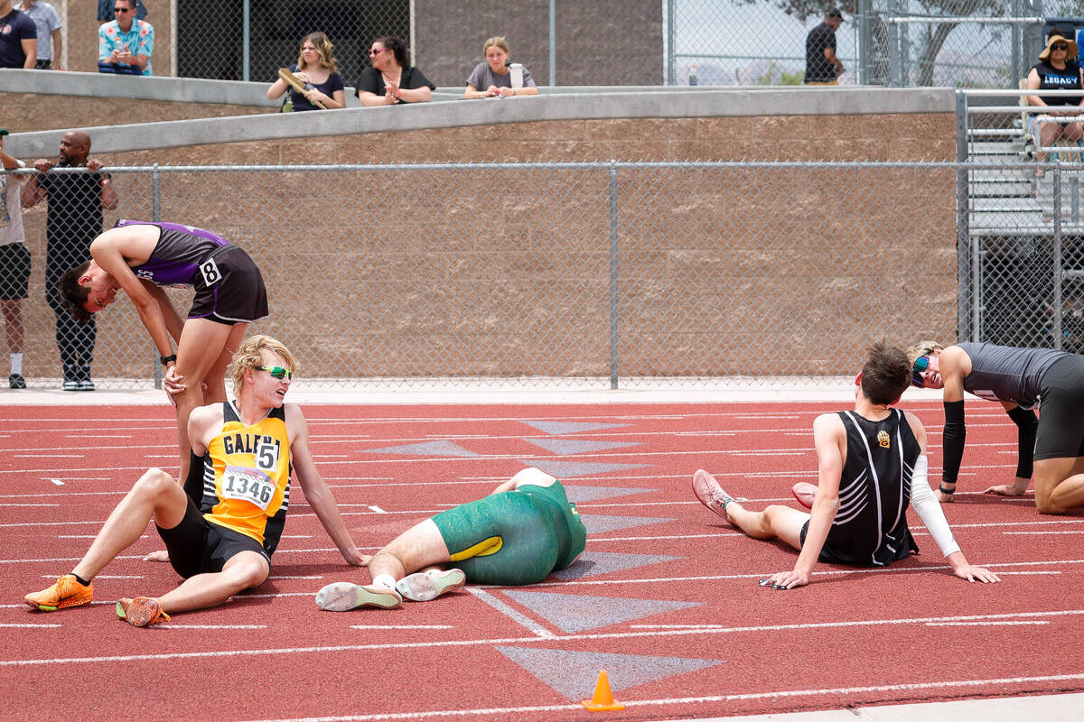 Runners catch their breath after the NIAA 5A Boys 800-meter run at Desert Oasis High School on ...
