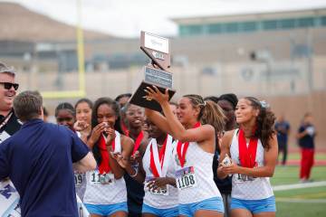 Centennial High School Girls’ track and field team raise the the NIAA 5A Girls track and fiel ...