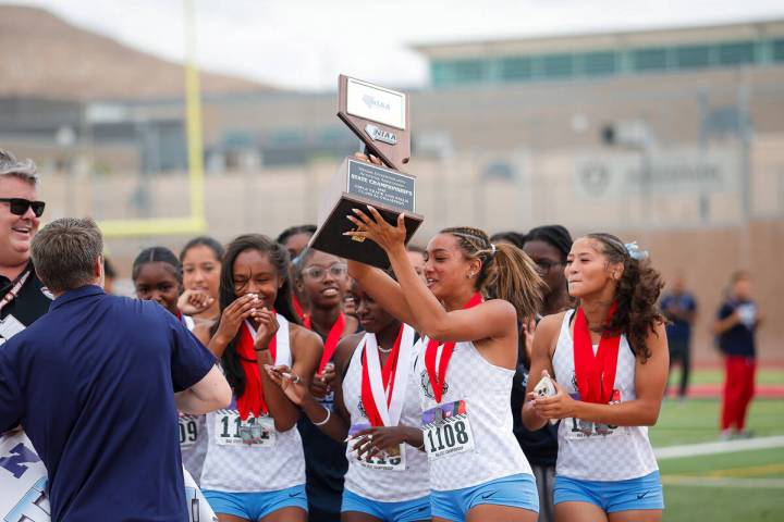 Centennial High School Girls’ track and field team raise the the NIAA 5A Girls track and fiel ...