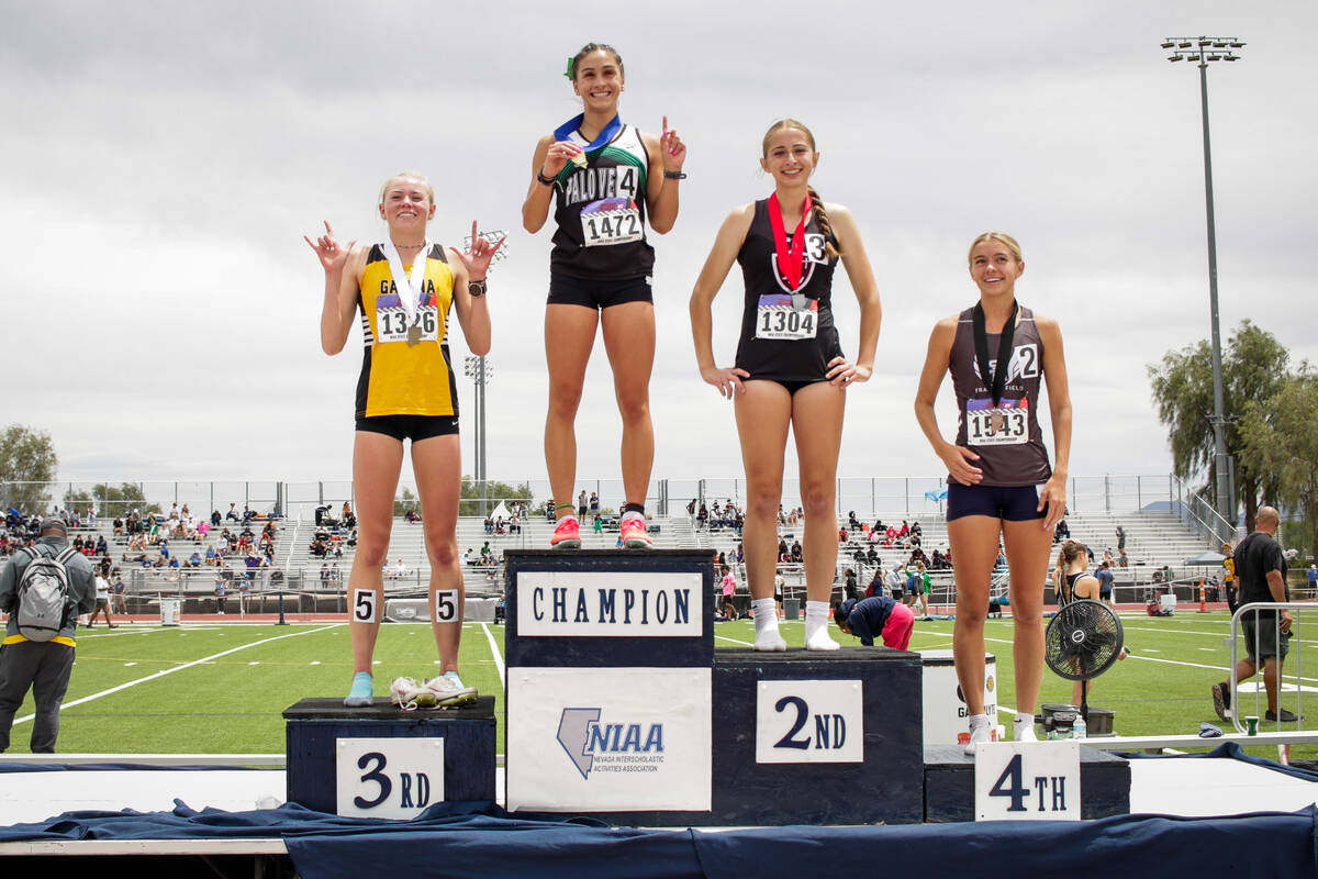 Medal winners of the NIAA 5A Girls 800-meter run final pose at the podium at Desert Oasis High ...