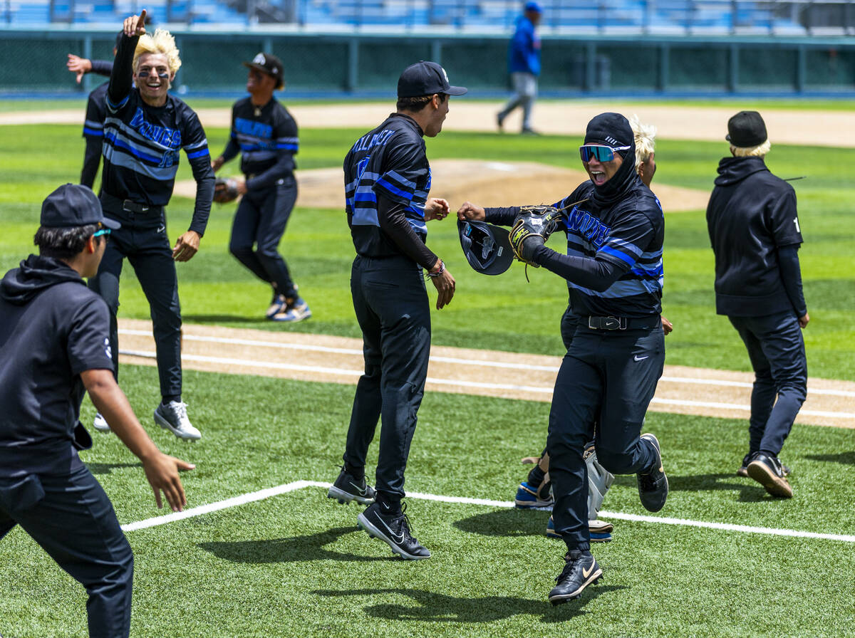 Basic players are pumped up as they keep Reno from scoring in extra innings during the final of ...