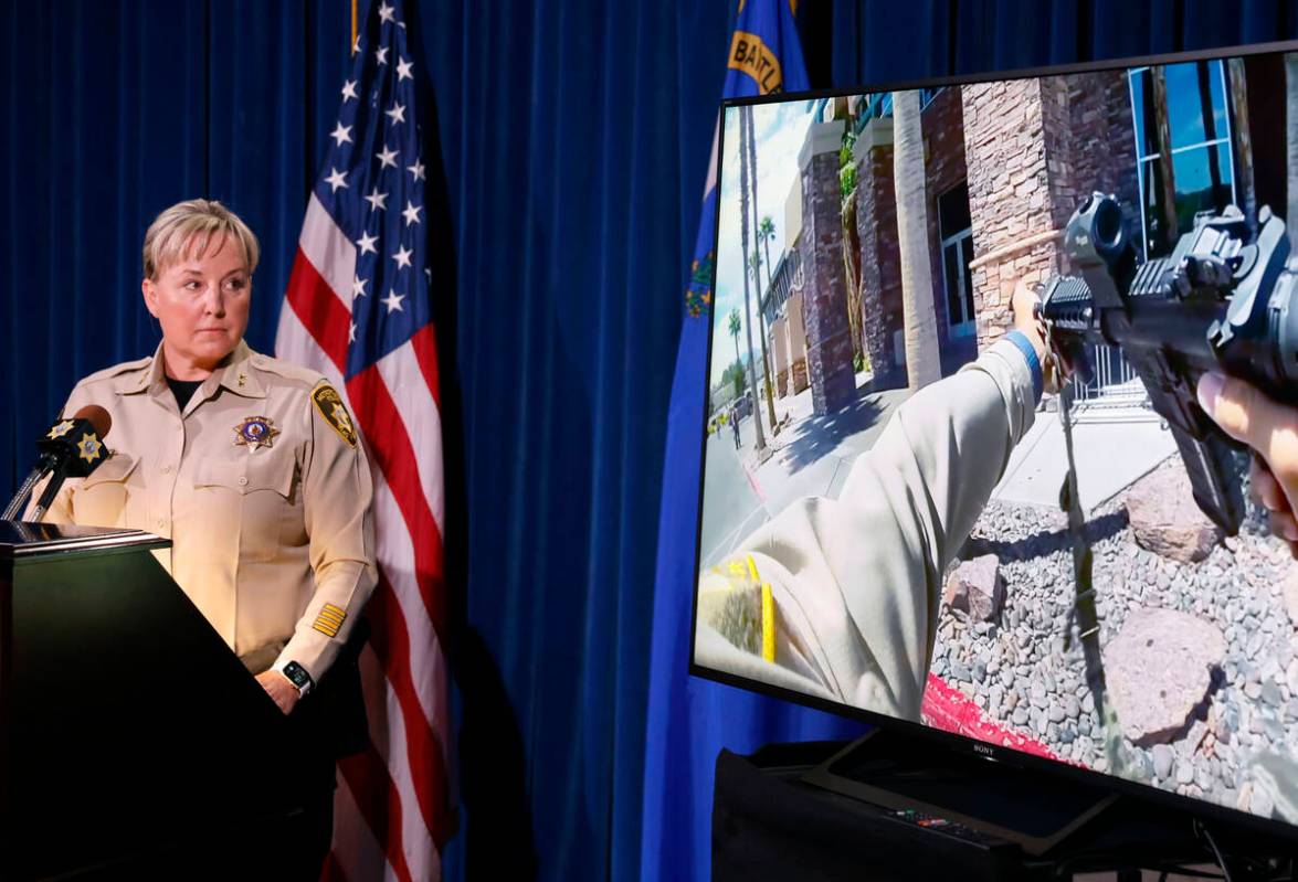 Body worn camera footage shows an officer pointing his weapon outside the Las Vegas Athletic Cl ...