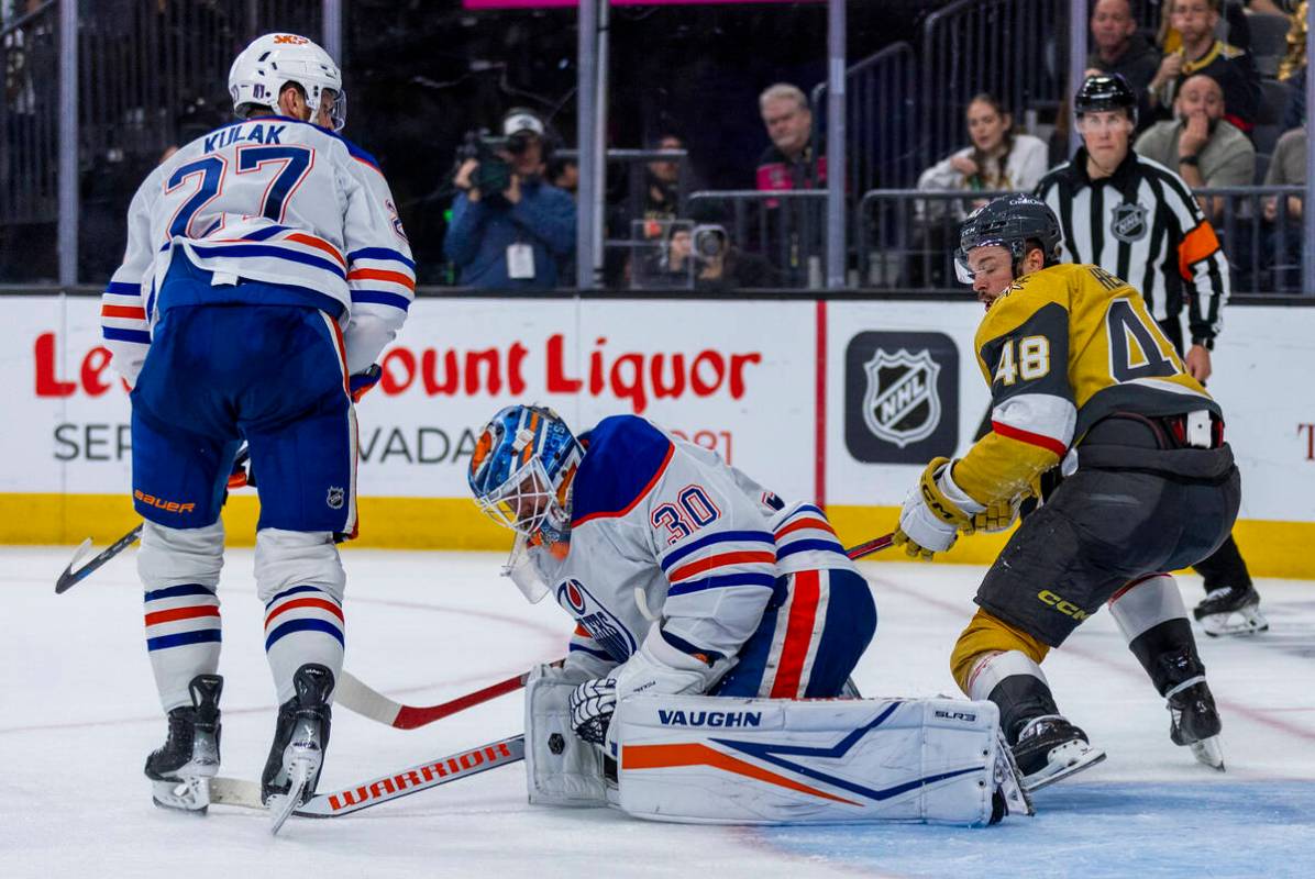 Edmonton Oilers goaltender Calvin Pickard (30) appears injured after defenseman Brett Kulak (27 ...