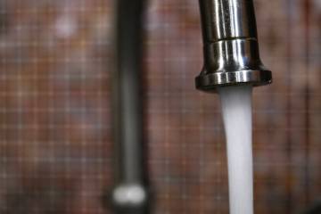 Water pours from a faucet Thursday, May 22, 2025, in Las Vegas. (Sam Morris/Las Vegas Review-Jo ...