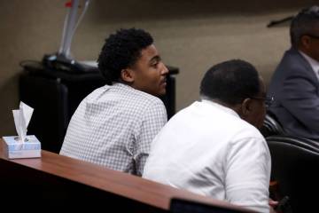 Former UNLV basketball recruit Zaon Collins, left, and his father Marvin Collins listen as Ramz ...