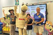 Joana A., a student at Elaine Wynn Elementary School, holds a trophy for winning the Mojave Max ...