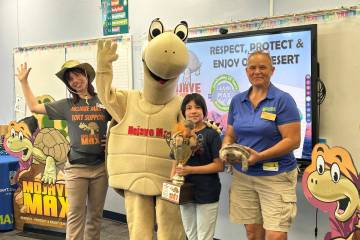 Joana A., a student at Elaine Wynn Elementary School, holds a trophy for winning the Mojave Max ...