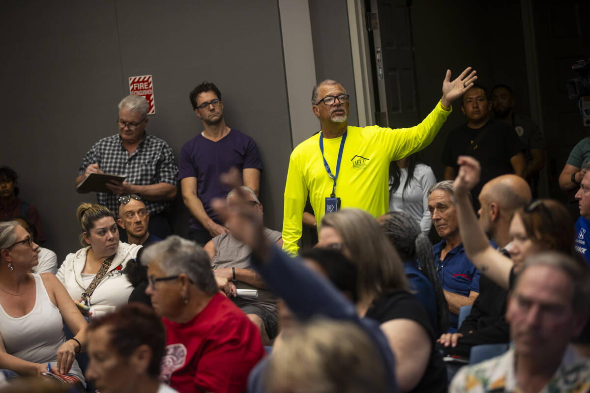 Louis Lacey, director of the crisis team for Help of Southern Nevada, speaks during a community ...