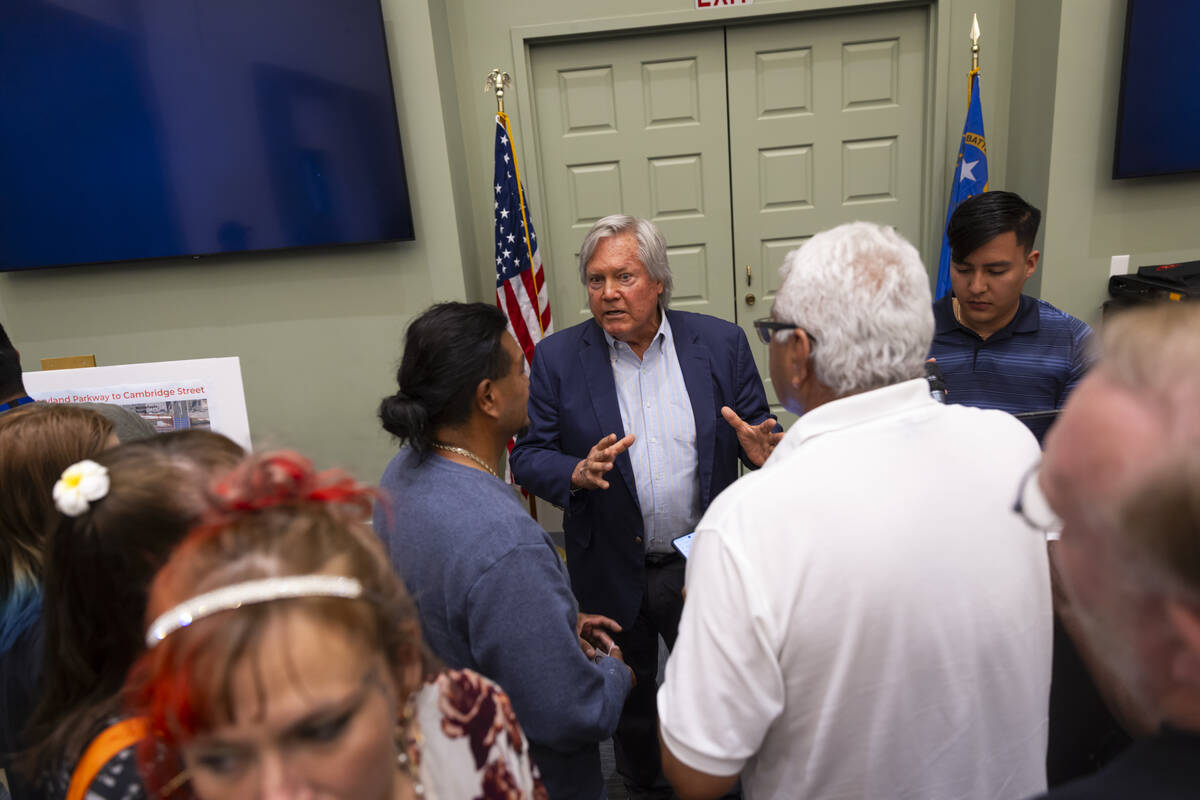 Clark County Commission Chairman Tick Segerblom talks with people following a community town ha ...