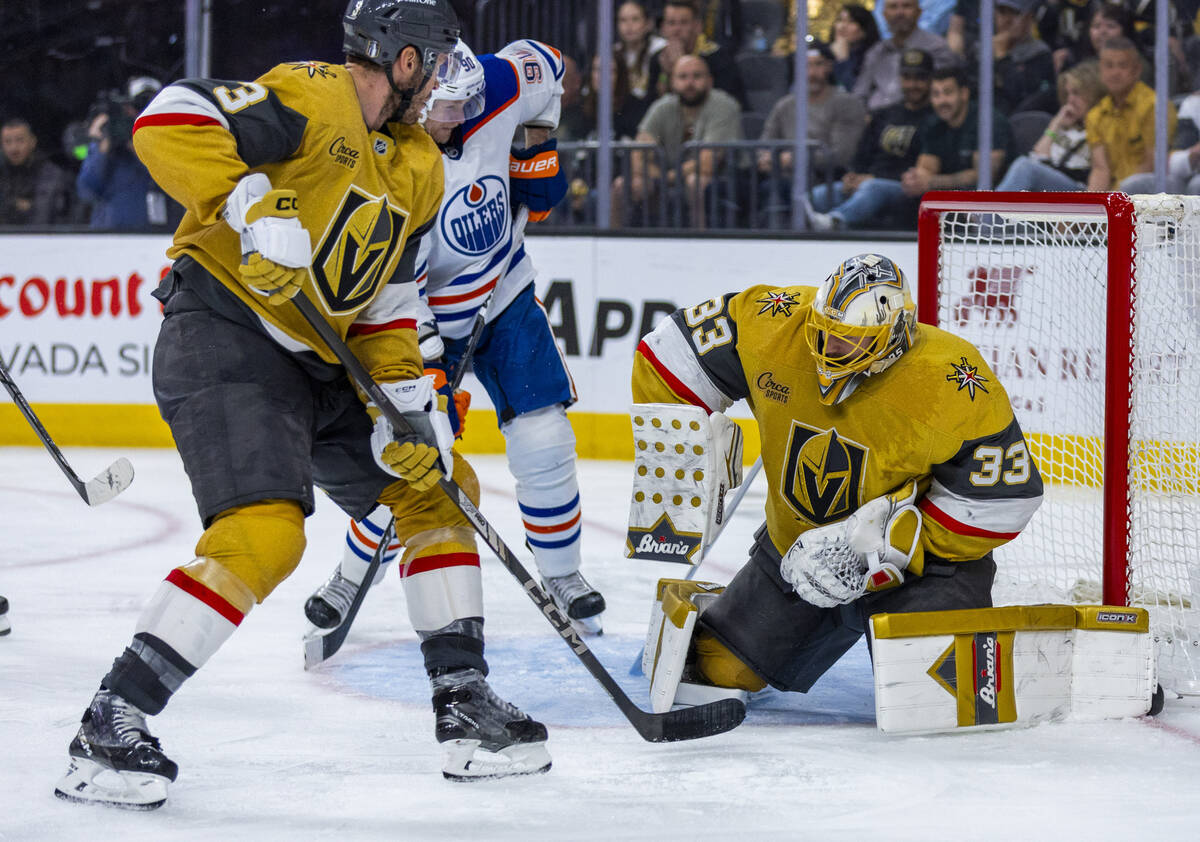 Golden Knights goaltender Adin Hill (33) stops a shot by Edmonton Oilers right wing Corey Perry ...