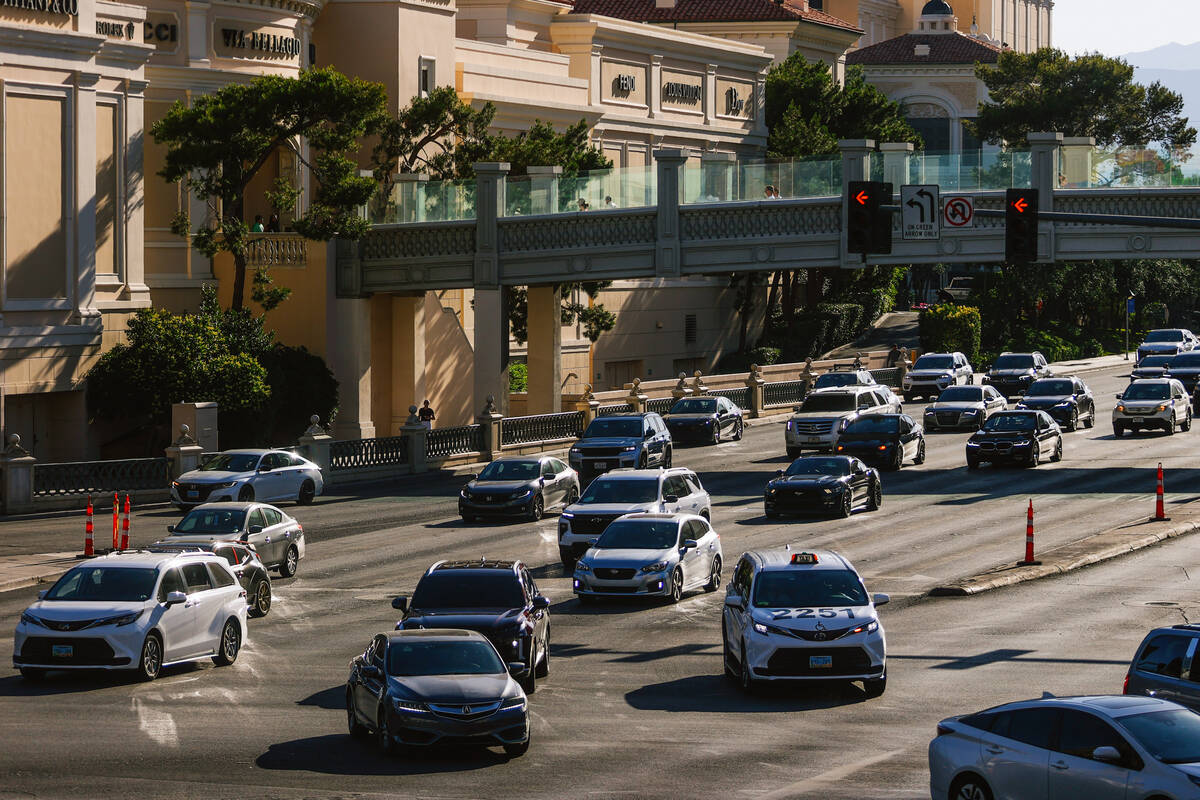 Cars drive on the Strip Wednesday, May 21, 2025, in Las Vegas. (Madeline Carter/Las Vegas Revie ...