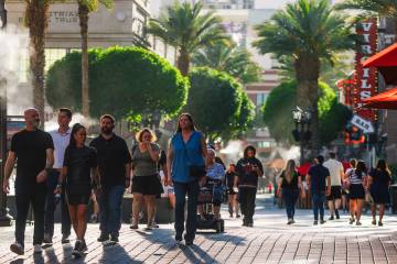 Pedestrians take in the Linq Promenade Wednesday, May 21, 2025, in Las Vegas. (Madeline Carter/ ...