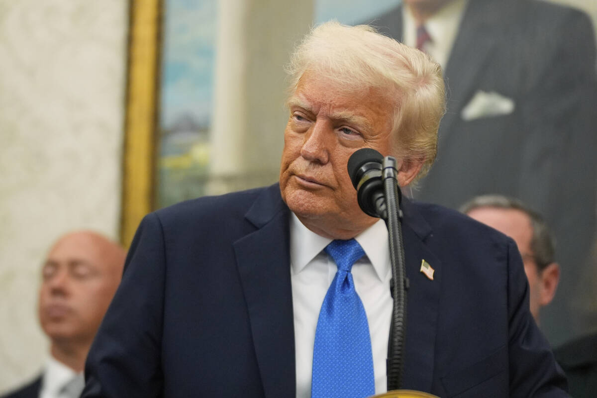 President Donald Trump listens to a question during an event to present law enforcement officer ...
