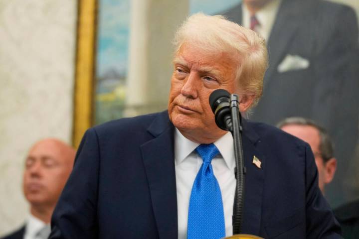 President Donald Trump listens to a question during an event to present law enforcement officer ...