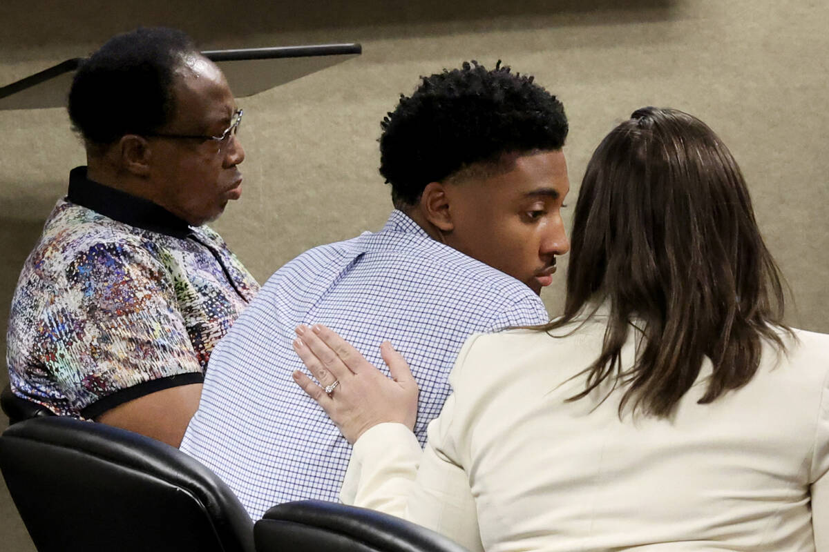 Former UNLV basketball recruit Zaon Collins, center, is comforted by his attorney Stephanie Zin ...