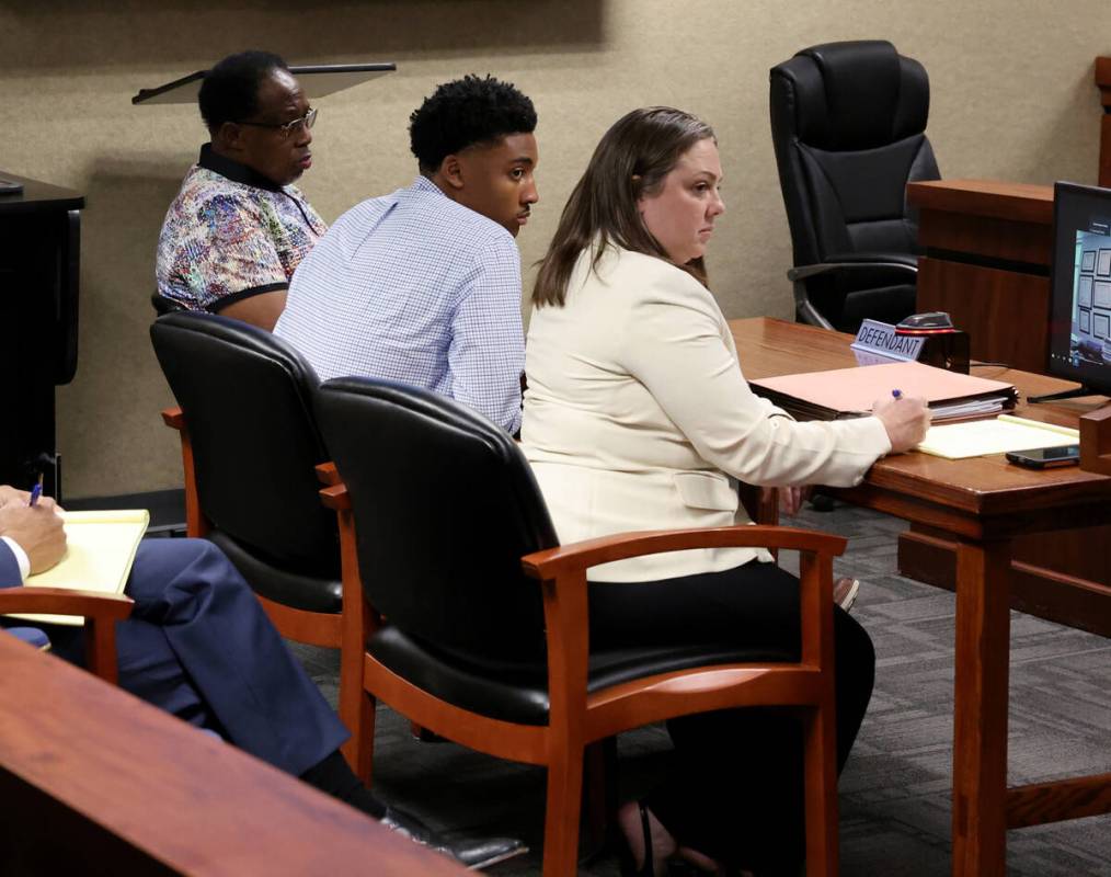 Former UNLV basketball recruit Zaon Collins, center, listens with his attorney Stephanie Zinna ...